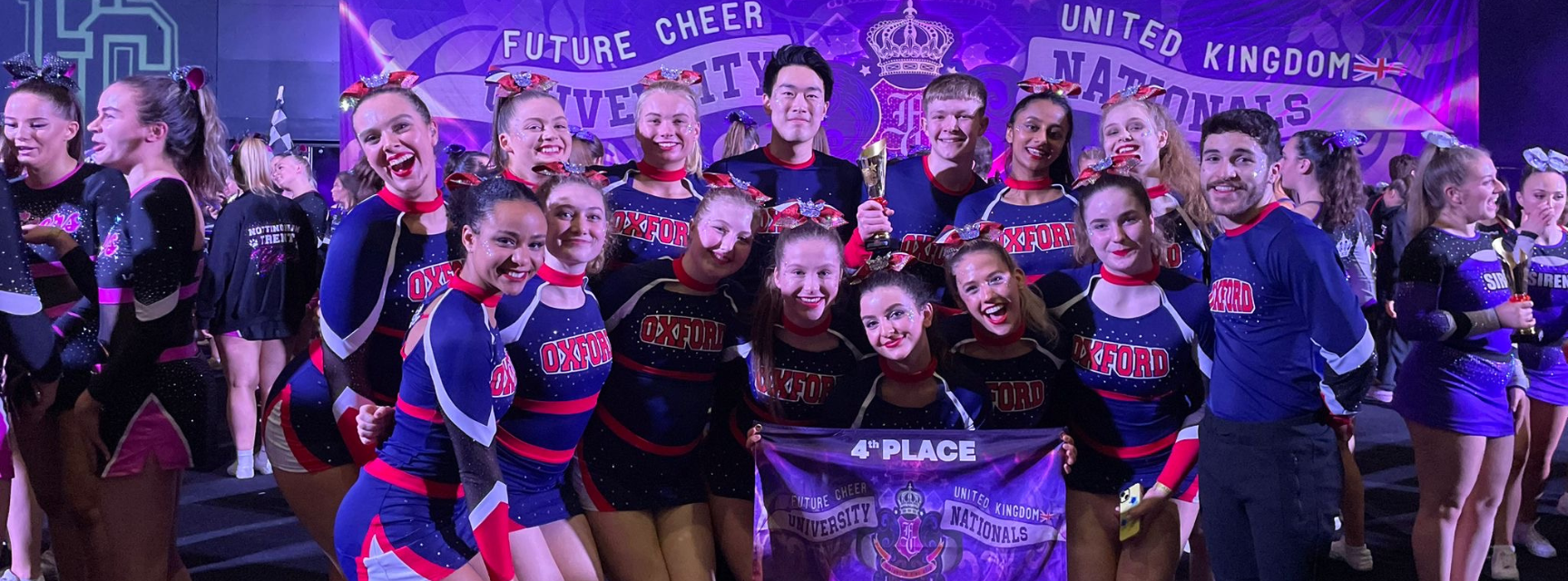 A squad of mixed cheerleaders celebrating 4th place at the national championships