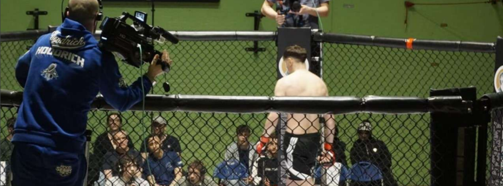 An MMA walking around the octagonal ring