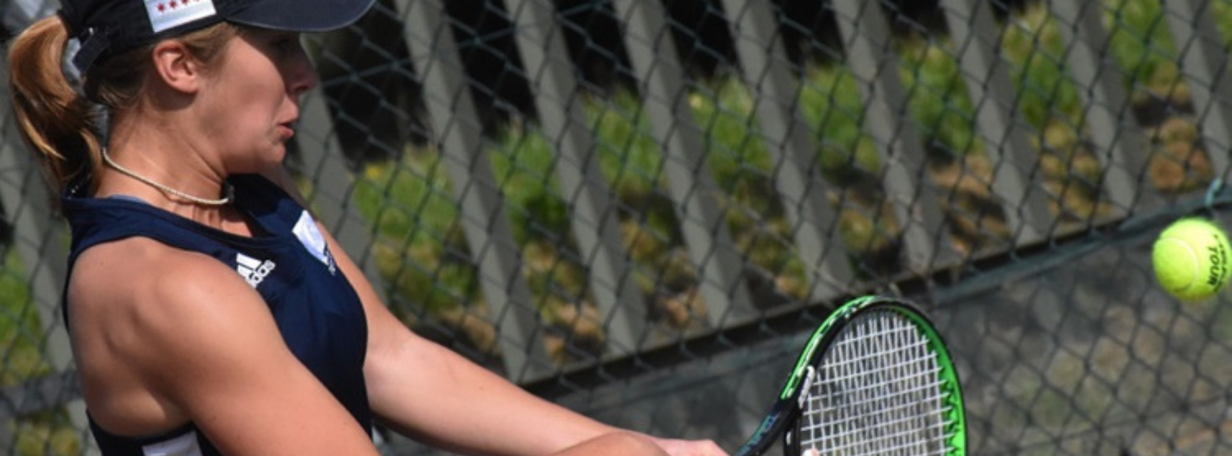 Izzy Marshall hitting a tennis ball