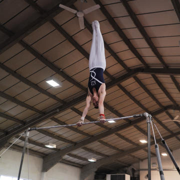 Sporting picture of of Lewis - our Club Committees Rep for 21/22 - training on the gymnastics bars